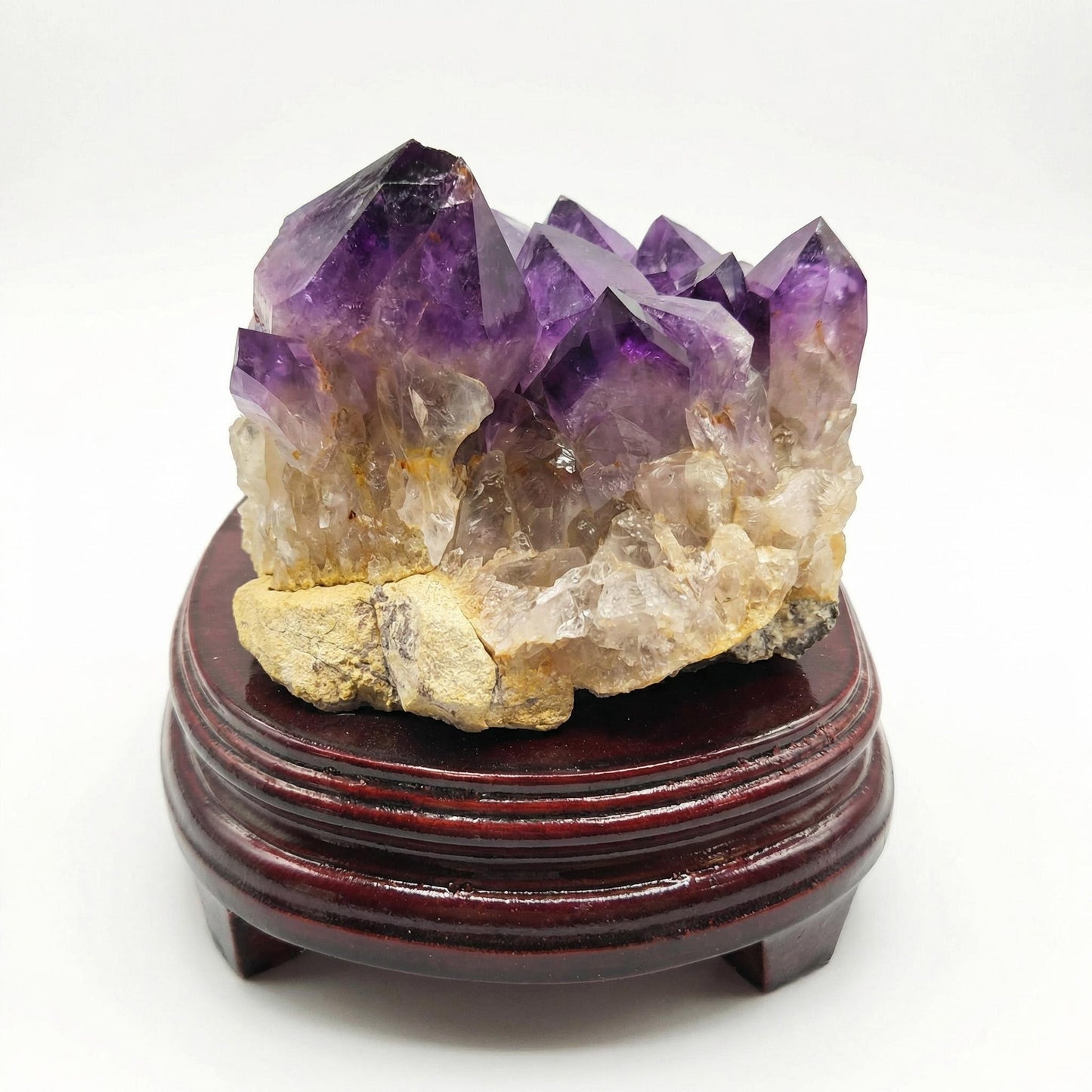 Amethyst cluster with wooden tray