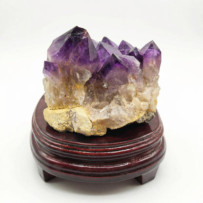 Amethyst cluster with wooden tray