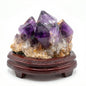 Amethyst cluster with wooden tray