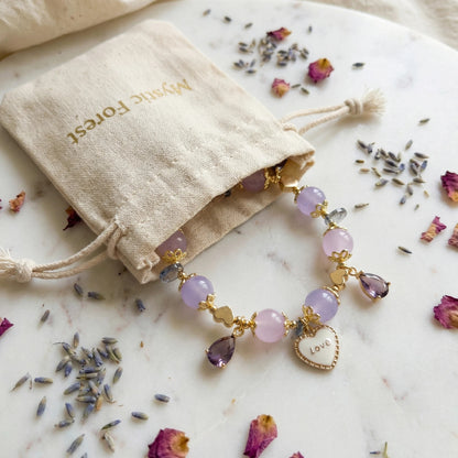 Whispers of Love Bracelet – Lavender jade, rose quartz, and amethyst bring love, elegance, and angelic protection.