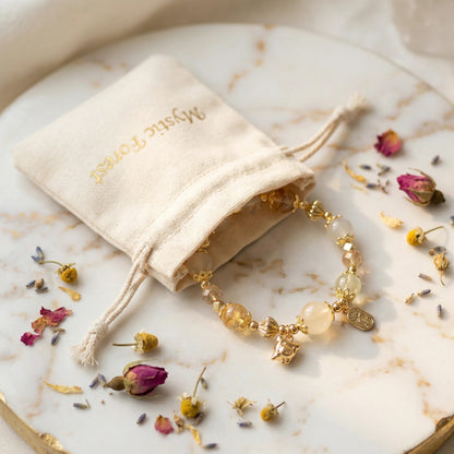 Golden Spirit Bracelet – White jade, white crystal, and amber crystal bring power, wisdom, and radiance.
