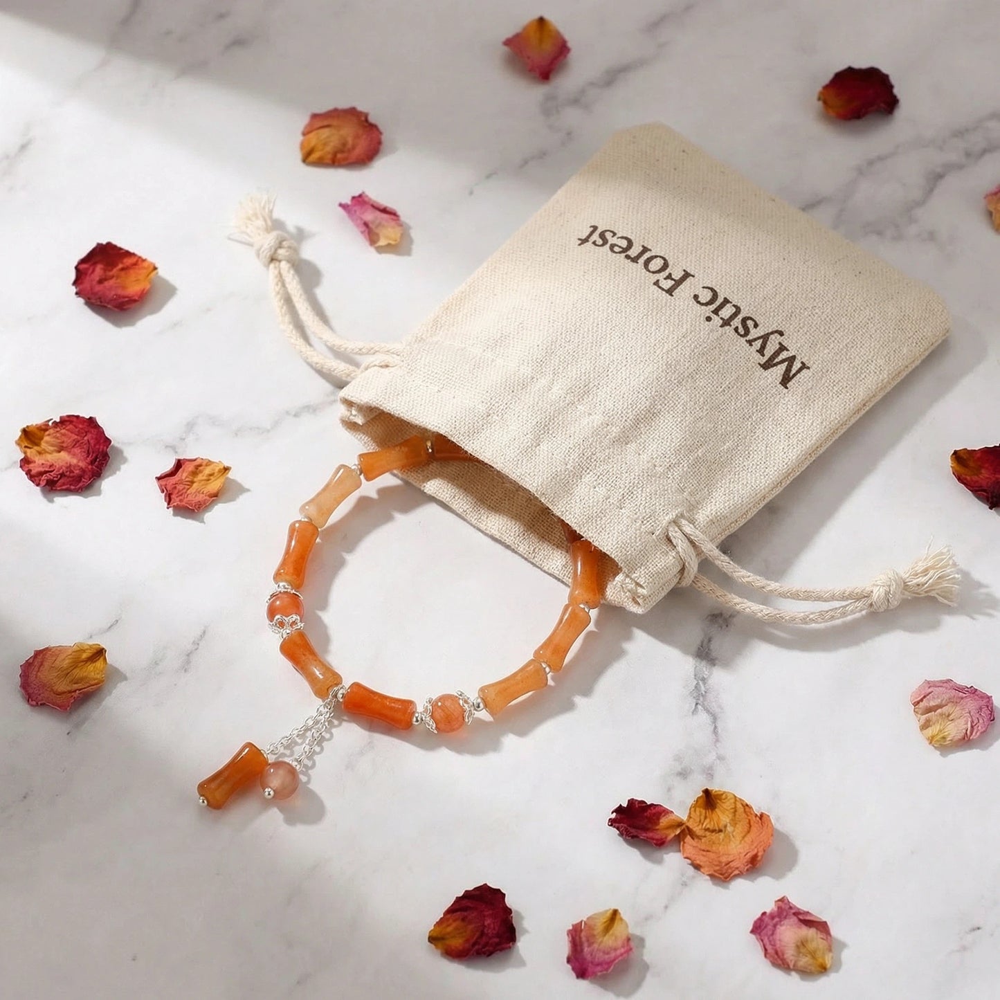The Bamboo Vitality Bracelet, featuring red aventurine and silver accents, brings dynamic, powerful, and flowing energy.