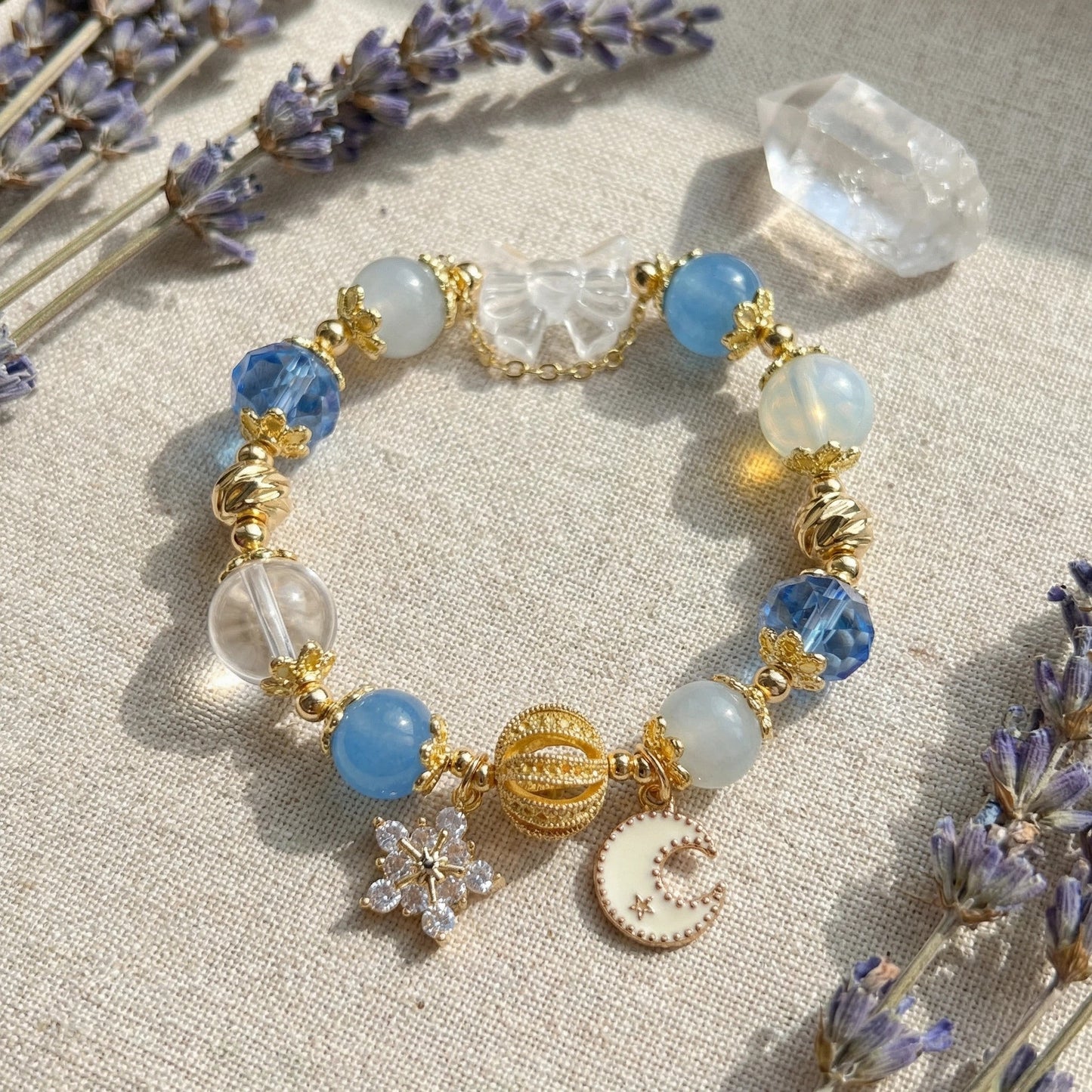 Moonlight Frost Bracelet – Blue crystal, opal, and clear quartz bring tranquility, magic, and winter elegance.
