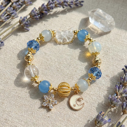 Moonlight Frost Bracelet – Blue crystal, opal, and clear quartz bring tranquility, magic, and winter elegance.