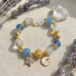 Moonlight Frost Bracelet – Blue crystal, opal, and clear quartz bring tranquility, magic, and winter elegance.