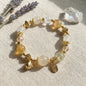 Golden Spirit Bracelet – White jade, white crystal, and amber crystal bring power, wisdom, and radiance.