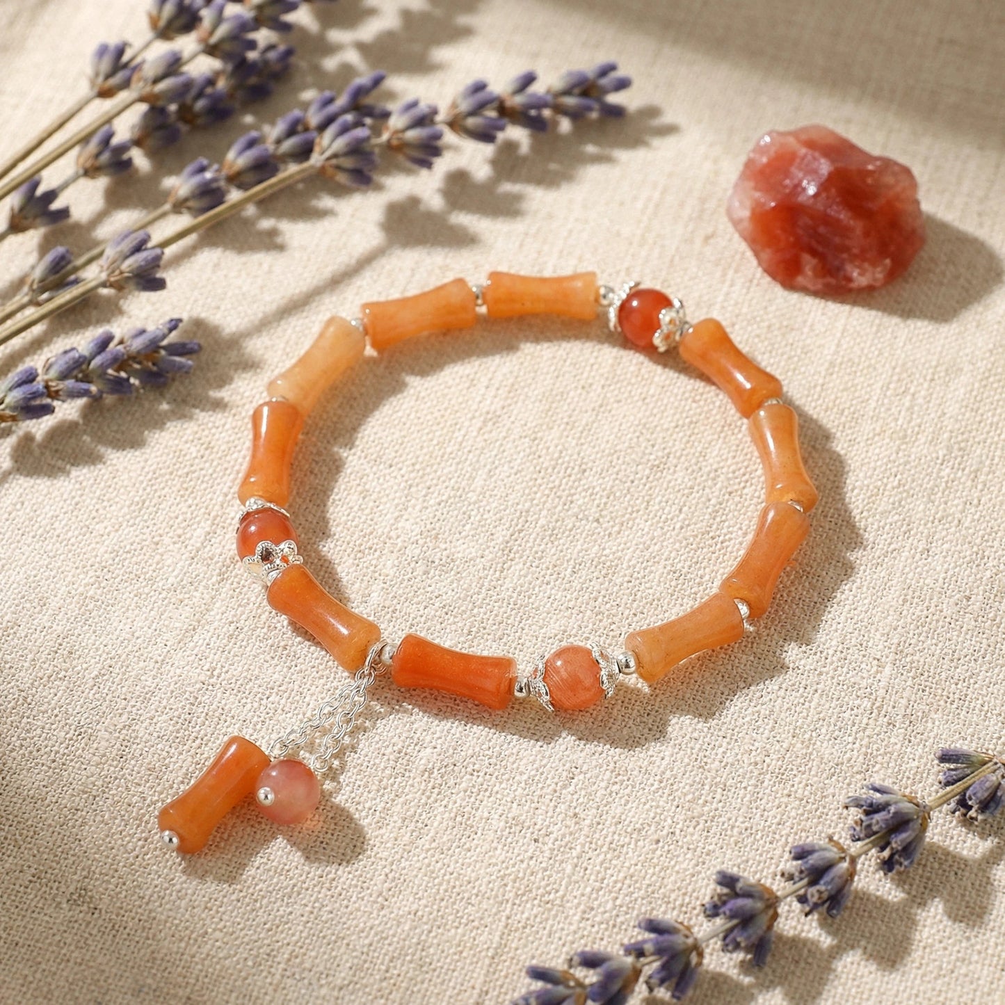 The Bamboo Vitality Bracelet, featuring red aventurine and silver accents, brings dynamic, powerful, and flowing energy.